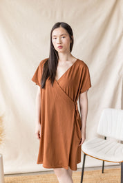 Copper jersey dress with cross-over front and drop shoulder – MAS Montréal, SS27