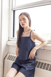 Indigo denim peplum top with tie straps – MAS Montréal, SS27