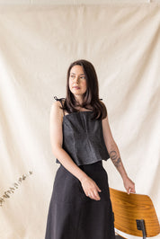 Black denim peplum top with tie straps – MAS Montréal, SS27