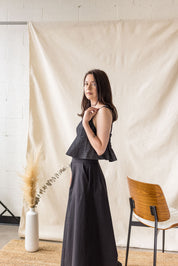 Black denim peplum top with tie straps – MAS Montréal, SS27