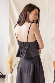 Black denim peplum top with tie straps – MAS Montréal, SS27