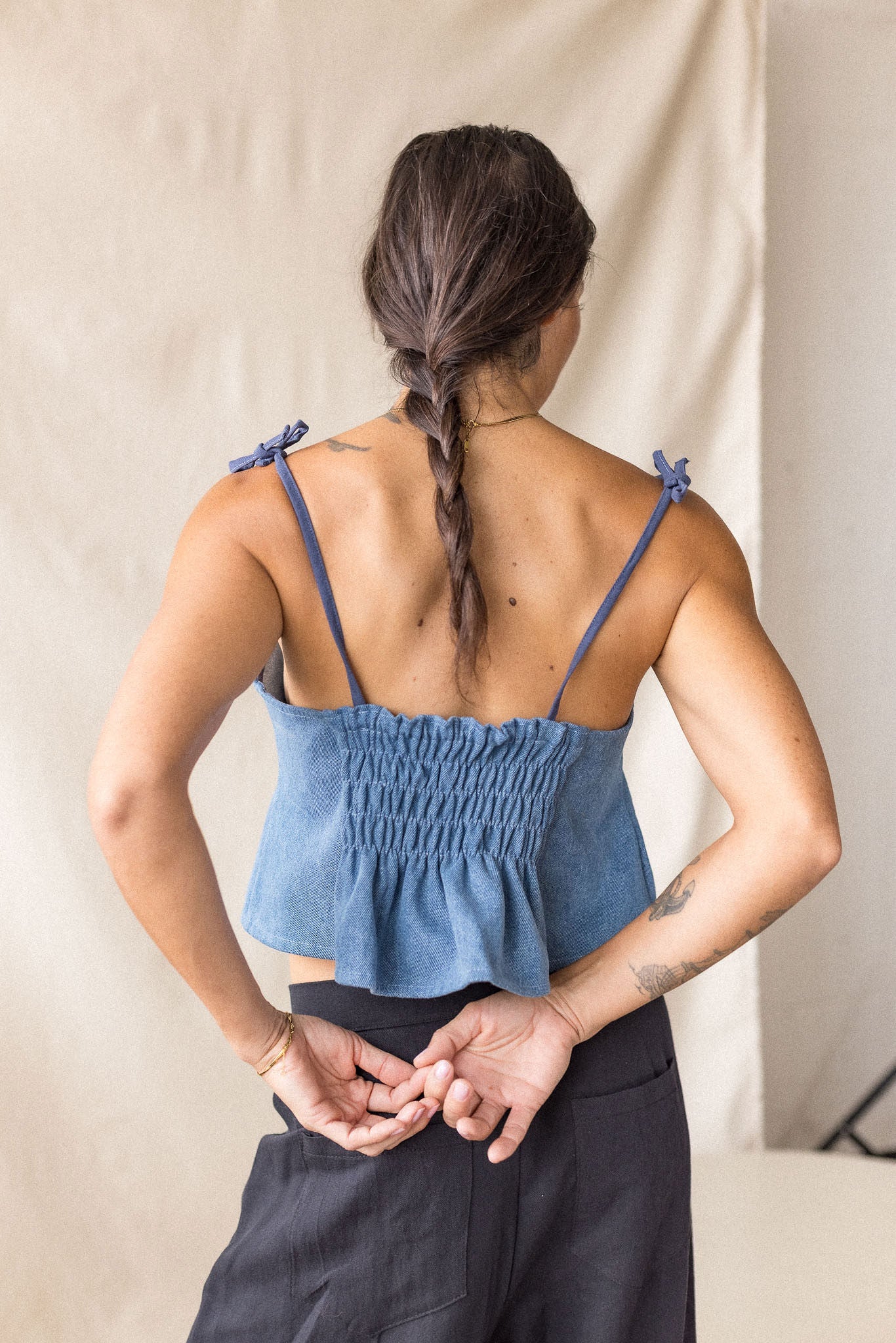 Blue denim peplum top with tie straps – MAS Montréal, SS27