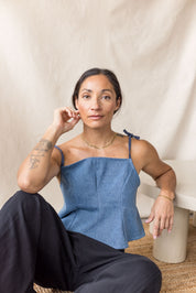 Blue denim peplum top with tie straps – MAS Montréal, SS27