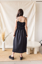 Black linen-cotton dress with tiered gathering and front ties – MAS Montréal, SS27