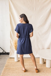 Indigo jersey dress with cross-over front and drop shoulder – MAS Montréal, SS27