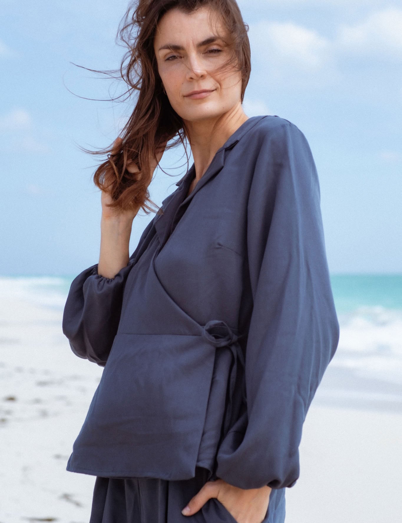 Skelling Blouse in Blue-Green (Lagoon) wrap-front lyocell blouse, side view - MAS Montréal