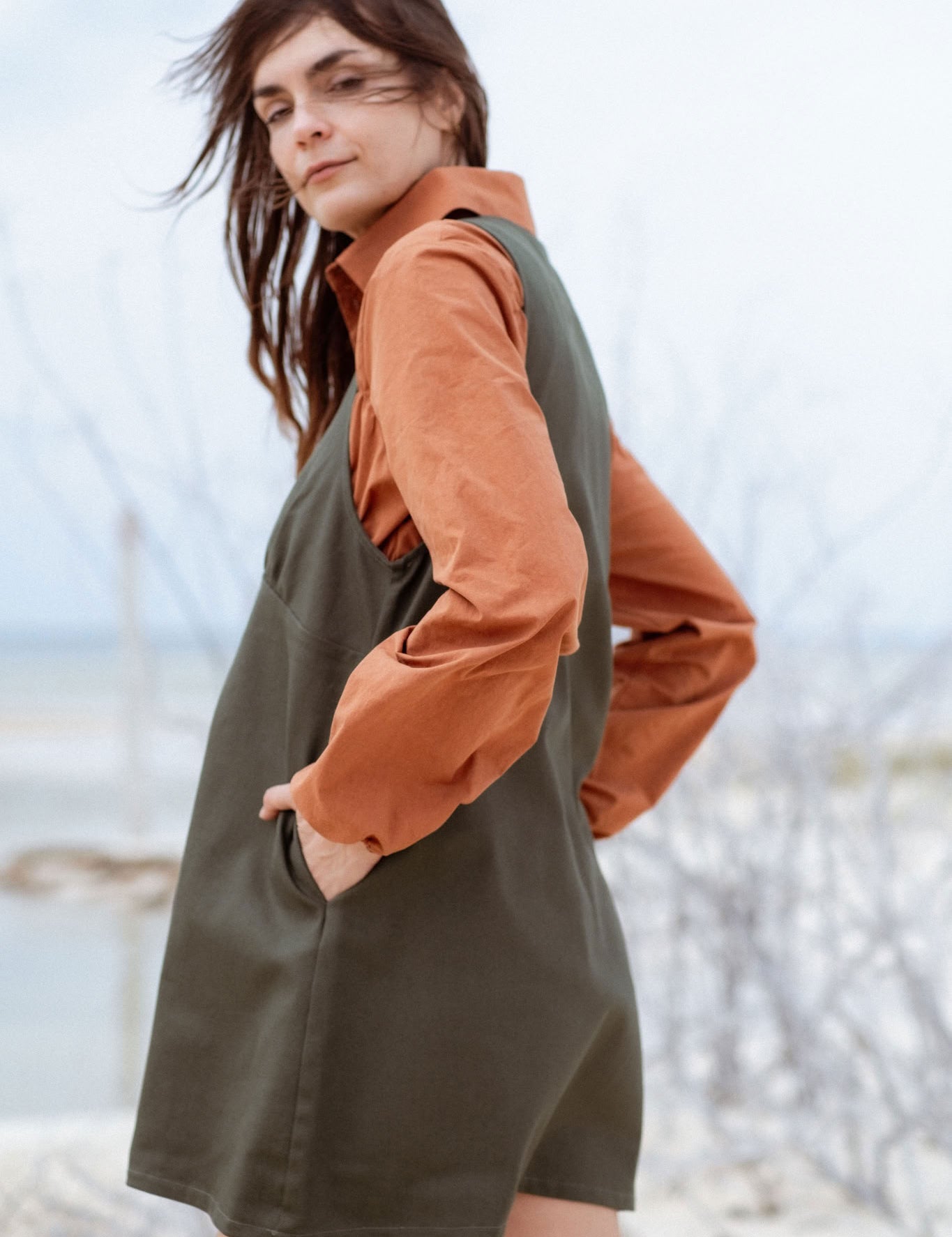 Valletta Dress in Faded Blue (Cedar) deep V-neck denim mini dress, side view - MAS Montréal
