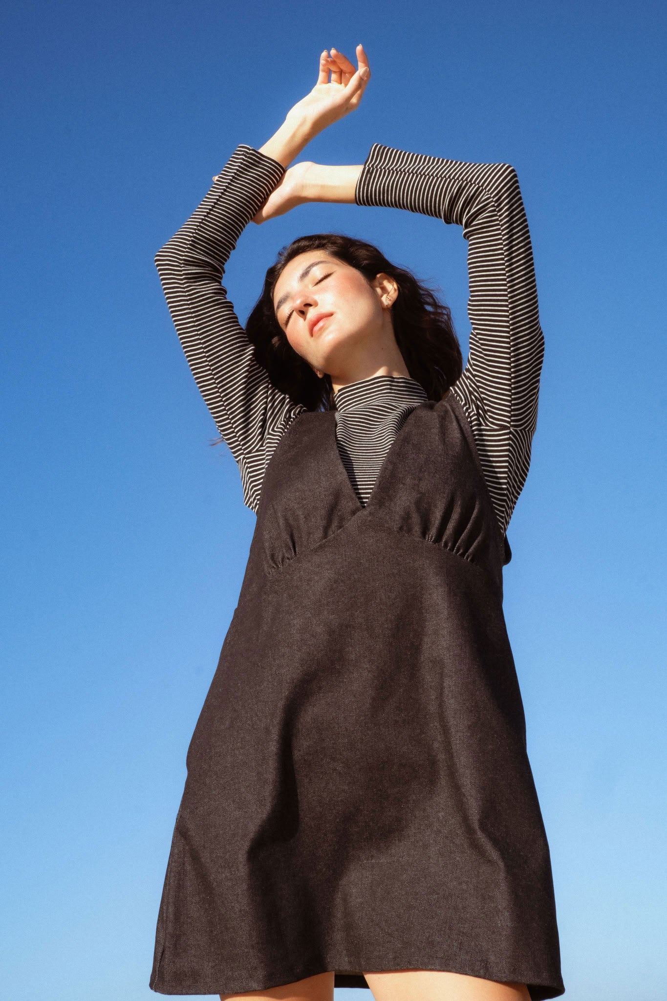 Valletta Dress in Black Denim (Carbon Denim) deep V-neck denim mini dress, back view - MAS Montréal