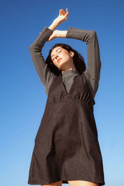 Valletta Dress in Black Denim (Carbon Denim) deep V-neck denim mini dress, back view - MAS Montréal