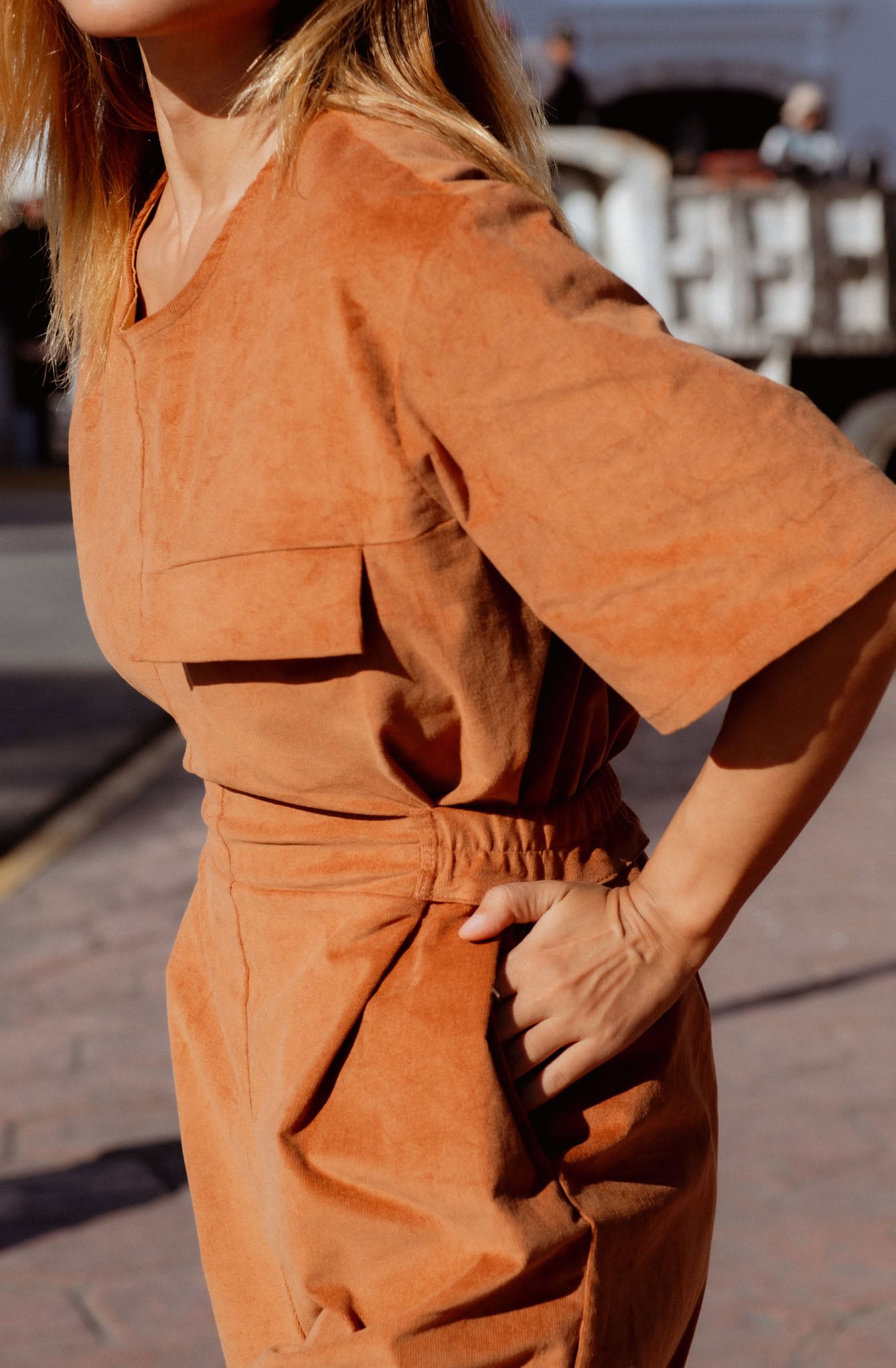 Bagan Jumpsuit in Rust (Copper) wide leg corduroy jumpsuit, side view - MAS Montréal