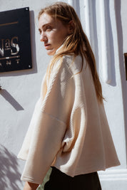 Byron Sweater in Off-White (Linen) oversized velvet rib turtleneck, worn - MAS Montréal