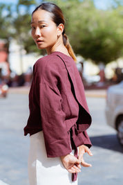 Arden Blouse in Burgundy (Mulberry) linen-cotton wrap blouse, side view - MAS Montréal