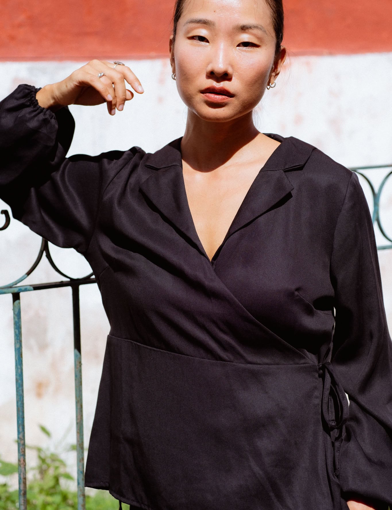 Skelling Blouse in Black (Carbon) wrap-front lyocell blouse, back view - MAS Montréal